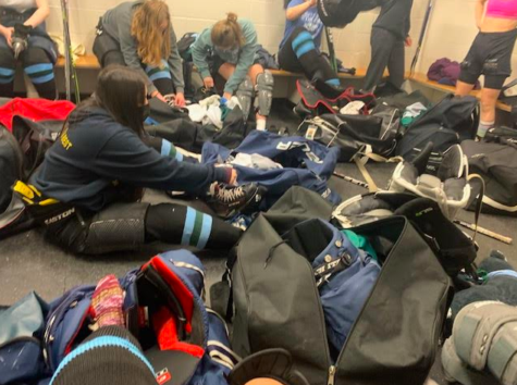 The women’s locker room before a game; cramped and dirty.