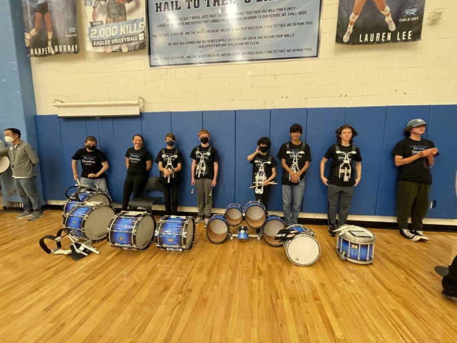 Drumline taking a break after leading everyone to the Pep Rally