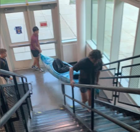 Kayak blocks stairway as student take Anything But a Backpack Day too far! 