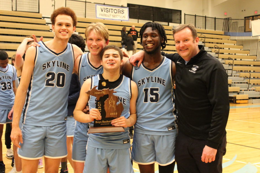 Lovelace (right) poses with players after a winning Districts in 2022. Credit: Ed Lynch