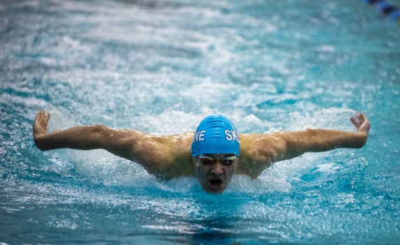 Jordan swims butterfly at a swim meet. Credit: Nicole Mckelvey