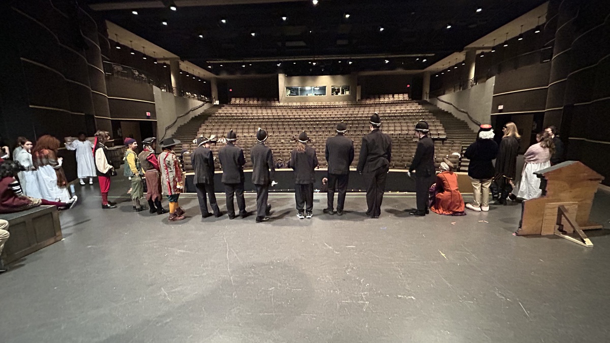 The cast of the Pirates of Penzance stand at the ready for mic checks. Credit: A. Gupta.