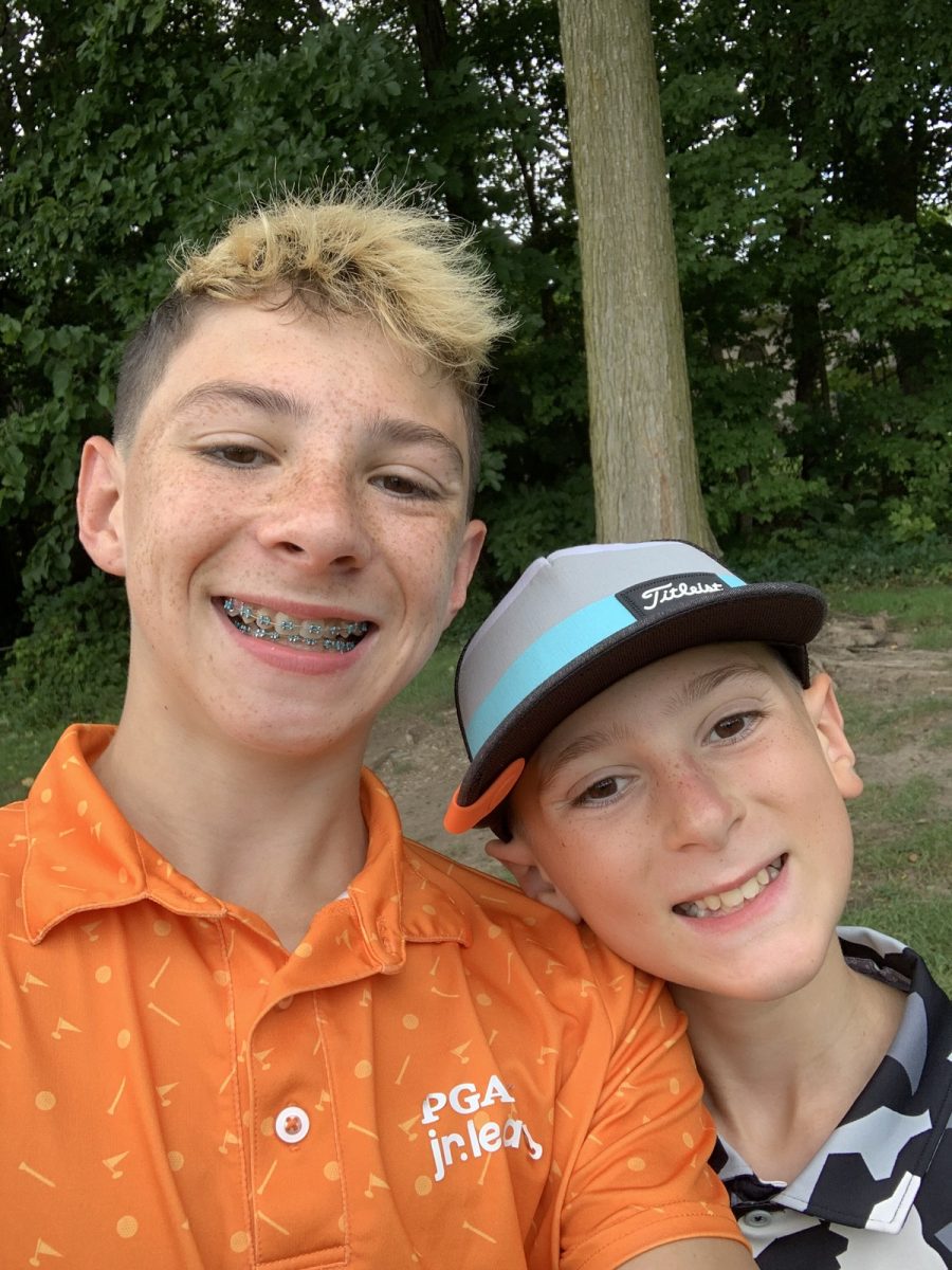 Max Cooper (‘27) golfing with his brother at Travis Pointe Country Club over the summer. Credit: M.Cooper.