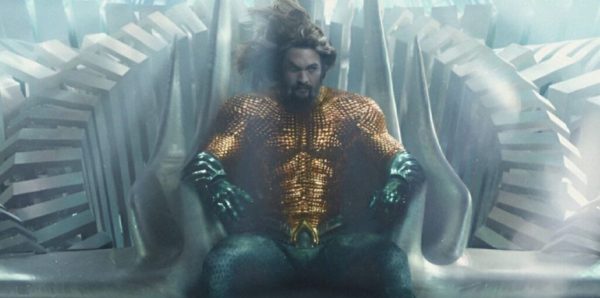Aquaman sitting on his throne in Atlantis. Credit: Warner Brothers Studios