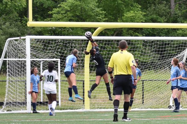Sofia Nehro jumps to save the ball. Credit: Dana Serlin.