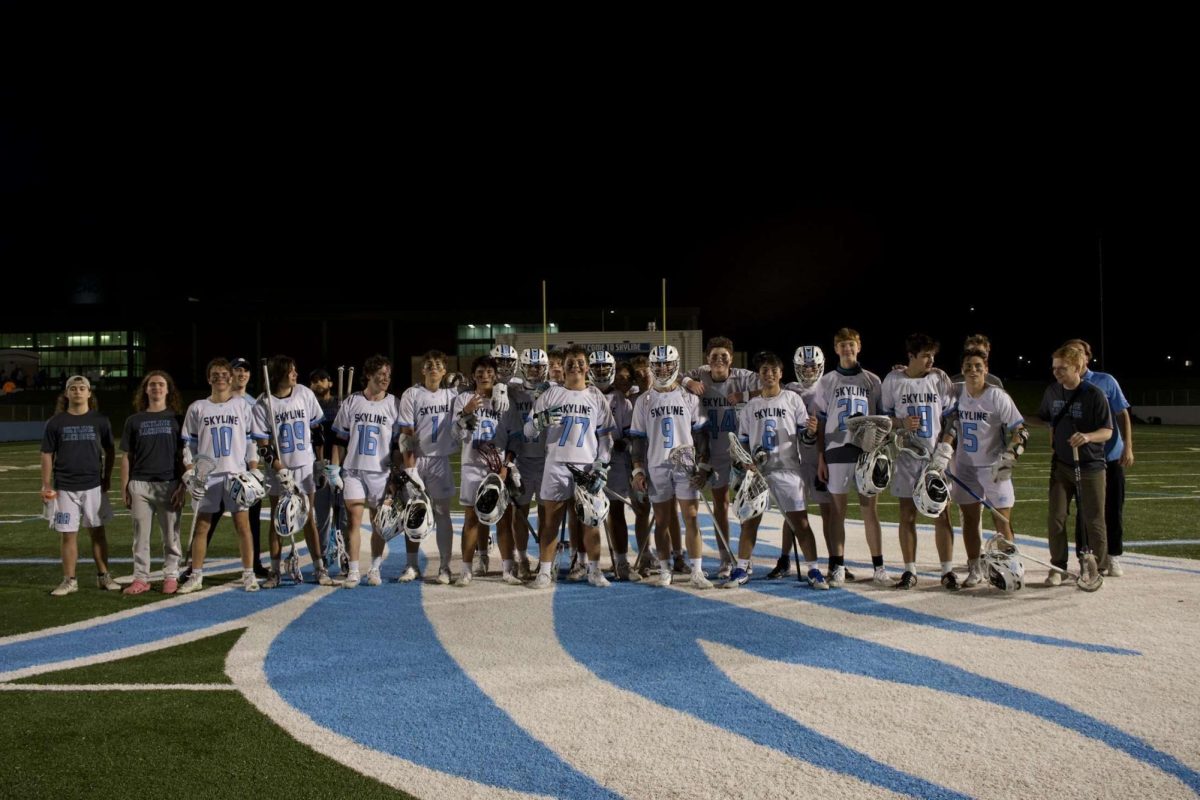 Mens Varsity lacrosse poses for a picture. Credit: Muj Mohammadi