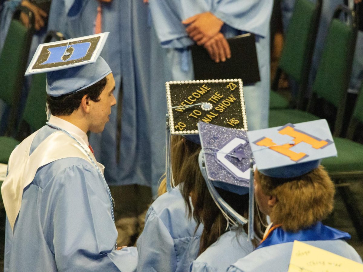 Seniors sporting their customized graduation caps and gowns at the 2023 Skyline Graduation. Credit: Lucas Caswell.