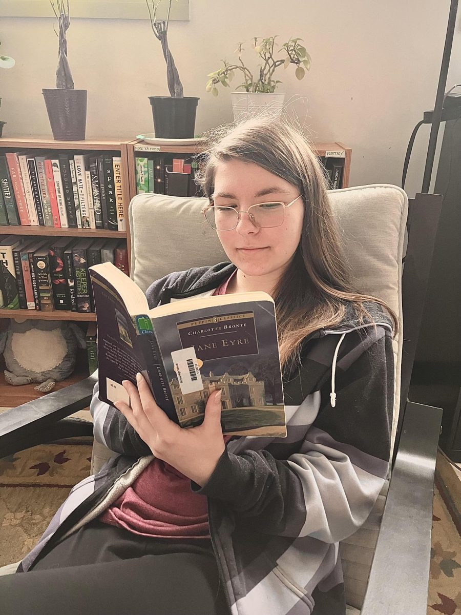 Skyline student Alison Green ('26) reading Jane Eyre to show everyone how smart she is.