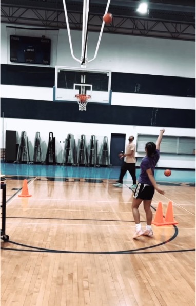 Mya Caddell playing basketball.