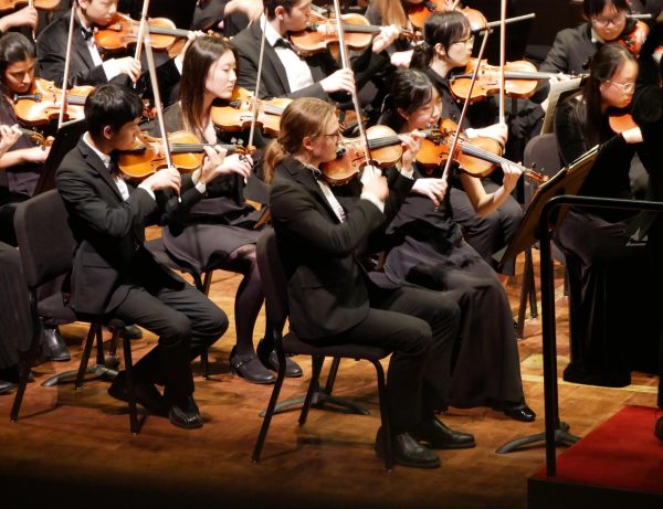 Emil Stachyra (‘25) leads the Michigan Youth Symphony Orchestra.