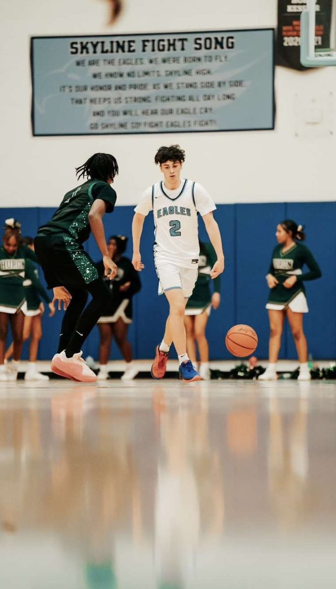 Ben Solomon dribbles past a rival defender.