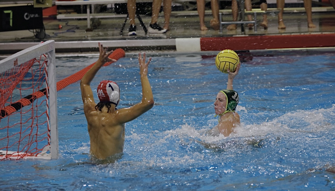 Goalie Matthew Christiansen ('25), preparing to face a shot.