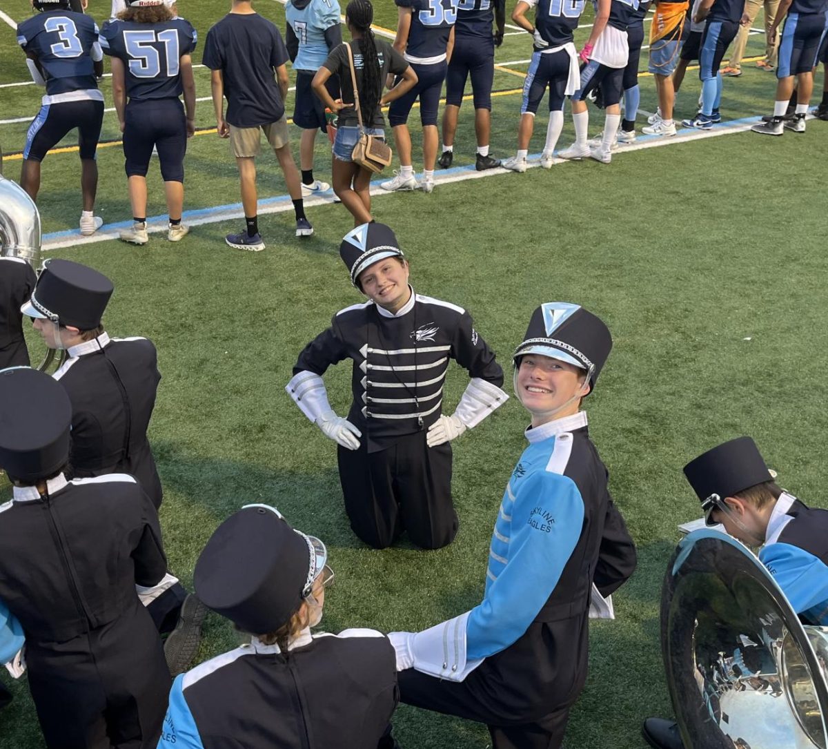 Drum Major Maxine Rosaen ('26) waiting behind the sidelines, ready to lead the Skyline Marching Band's halftime performance