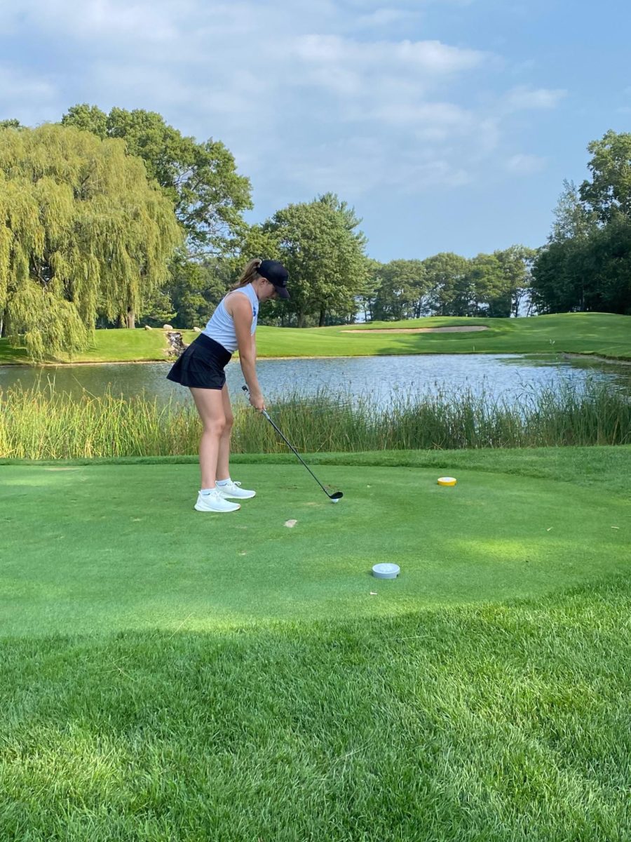 Liv Housler ('28) hits a tough shot during a match.