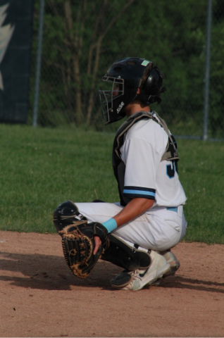 Jonah Tomassi catching during Skyline baseball game