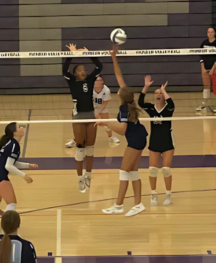 Zea Moghtader-Trumbull ('28) spikes ball in Freshman volleyball match.