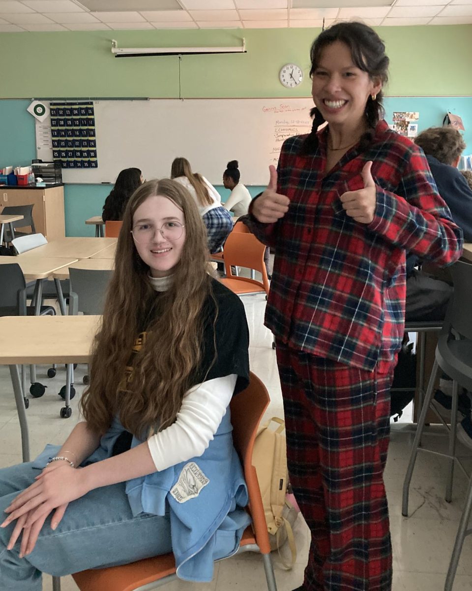 Julia Bansal (‘25) sports a plaid matching pajama set alongside Eleanor Wing (‘26).