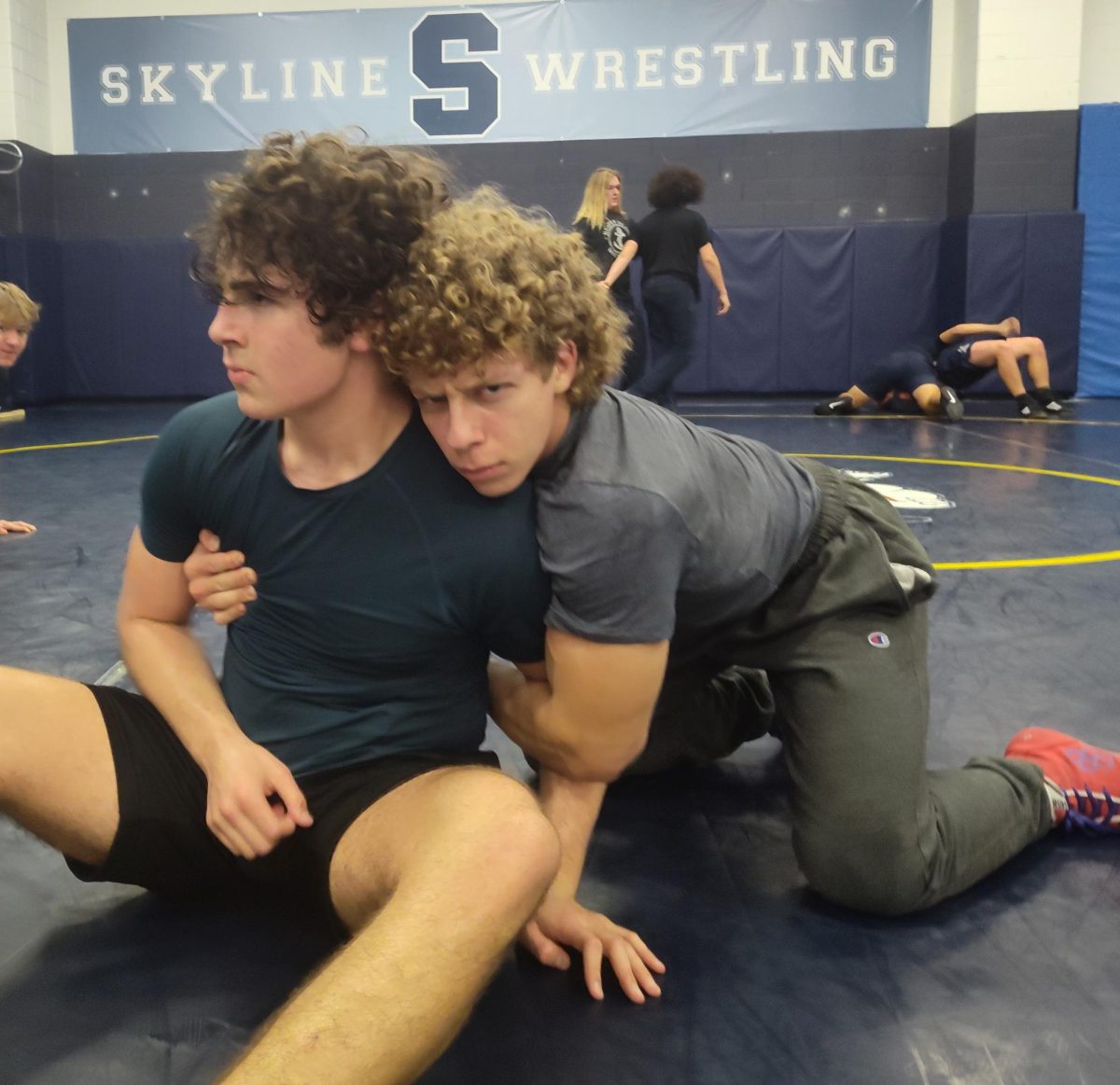 Peter Werns ('27) and Connor Gilliand ('25) wrestling.