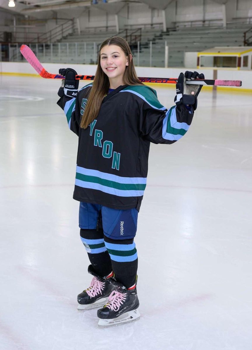 Skyron hockey player Emerson Nalepa ('28) posing.