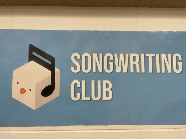 The Songwriting Club banner hanging in the music room.