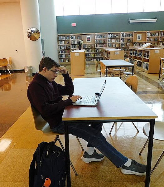 Kirill Zamulin (‘25) working in the library.