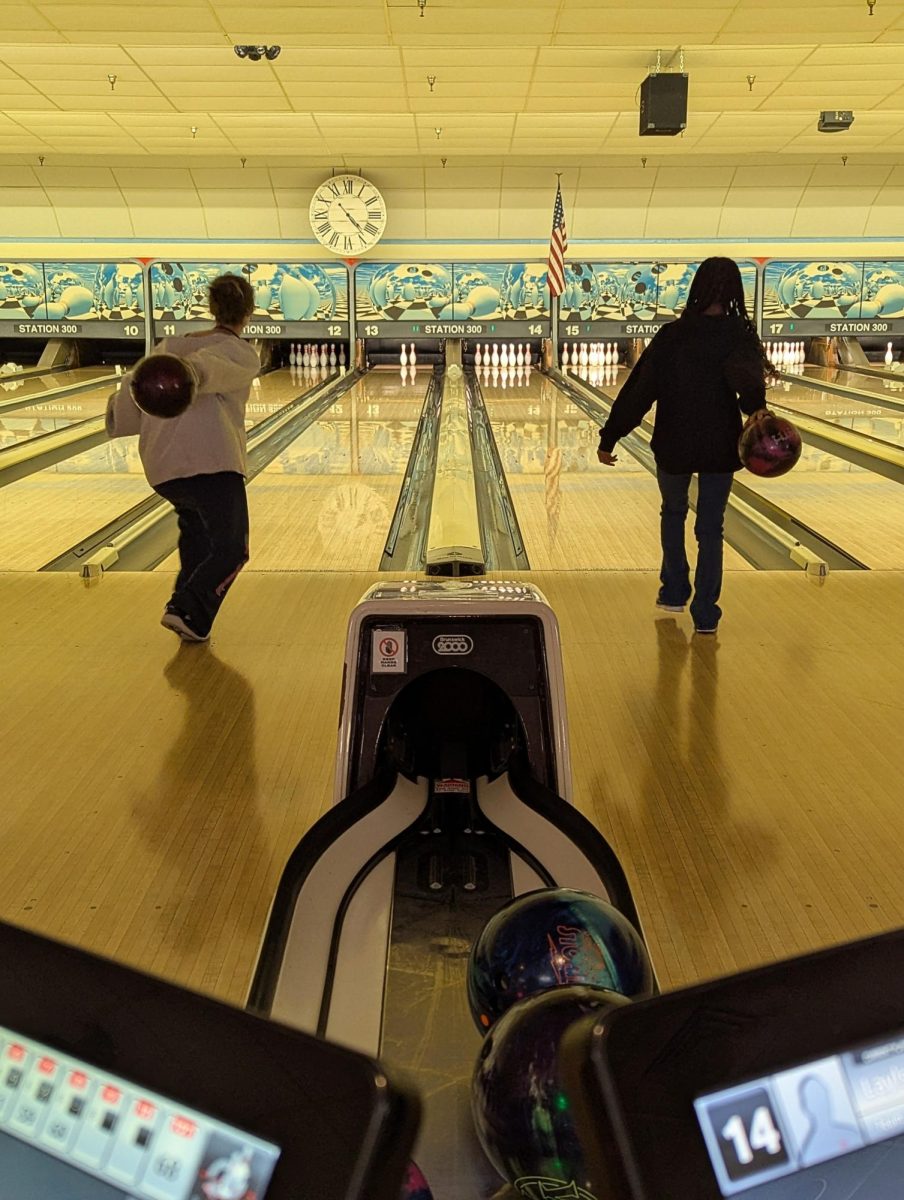 Grace Omar ('28) and Lai'la Wilborn ('25) bowling next to each other.