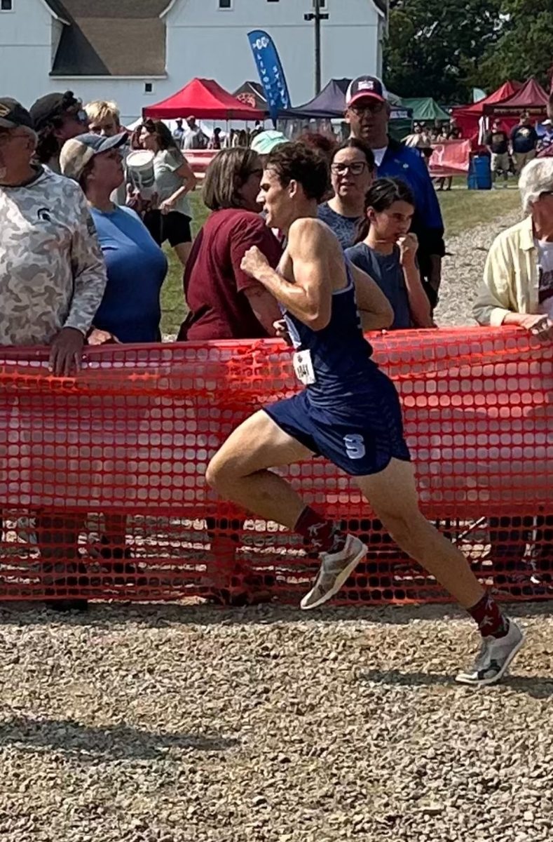 Jack Robichaud (‘25) running at a cross-country race.