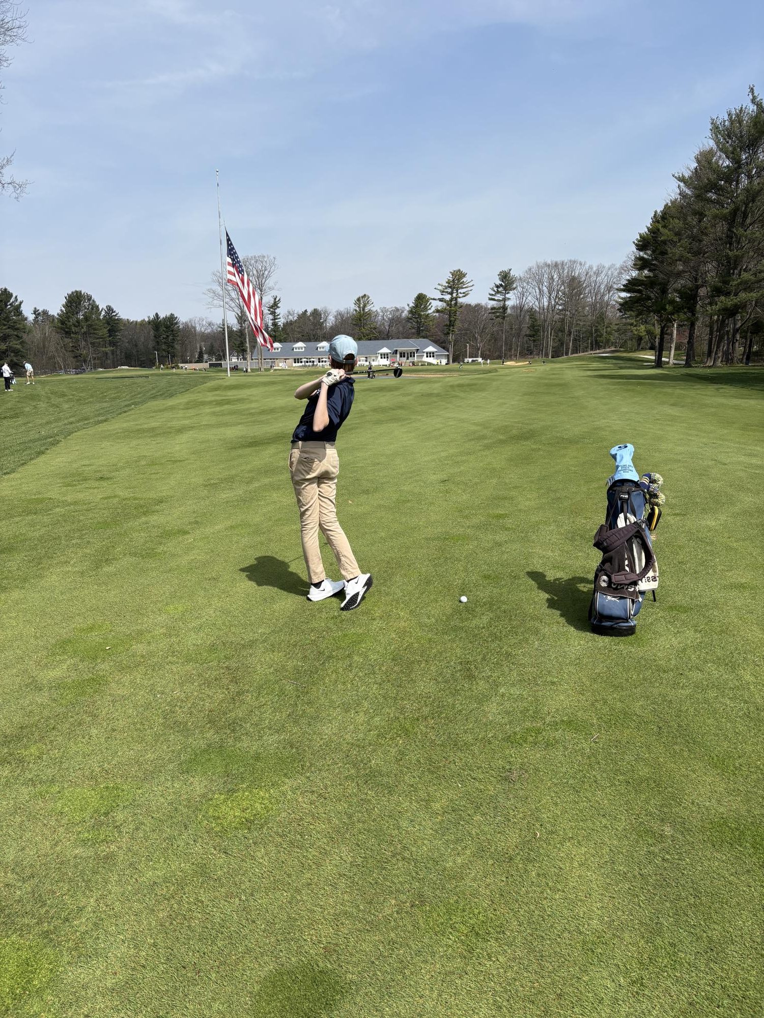 Jackson Hensley ('26) taking a practice swing before taking a stroke