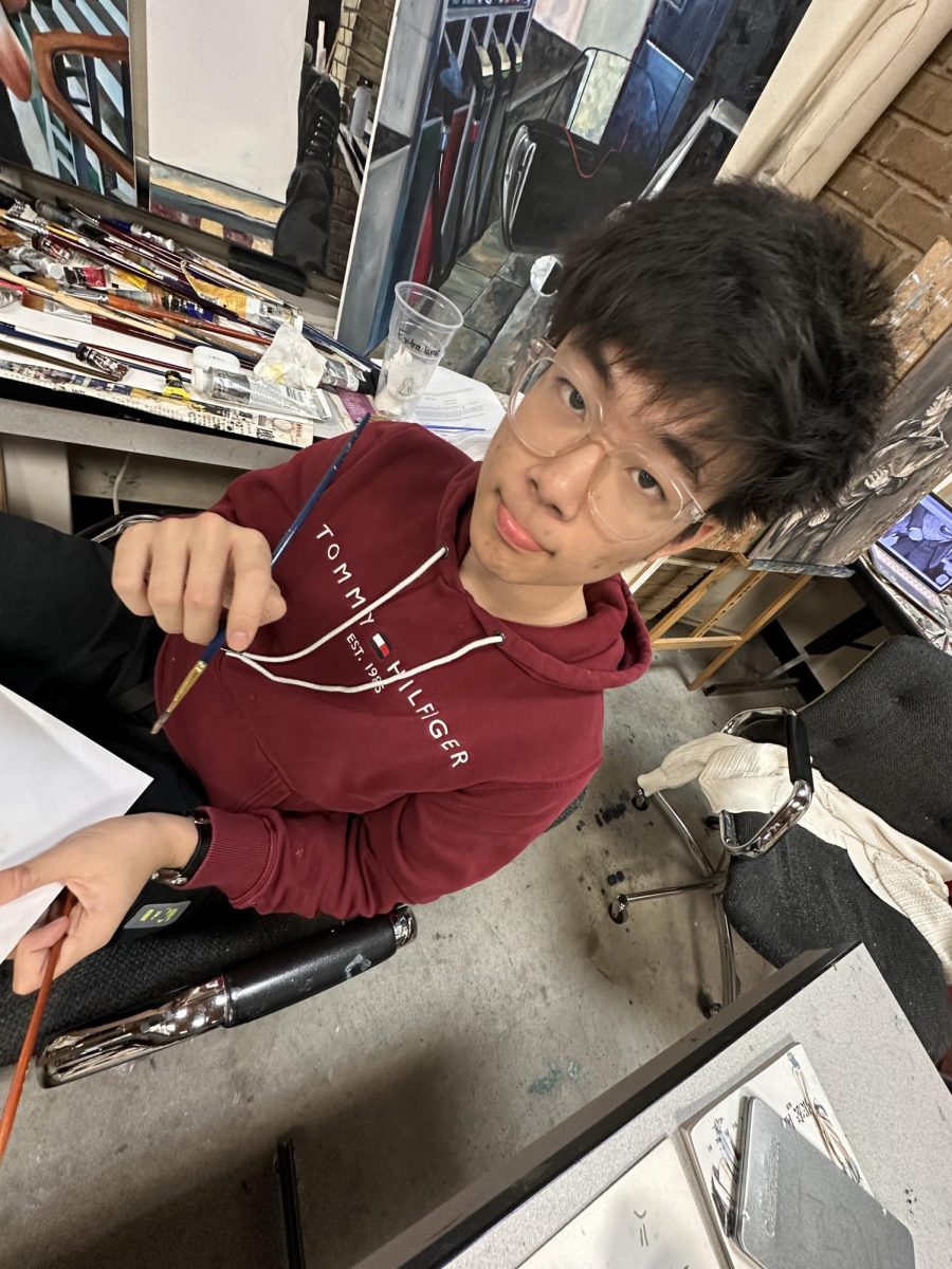 Leon painting at studio.