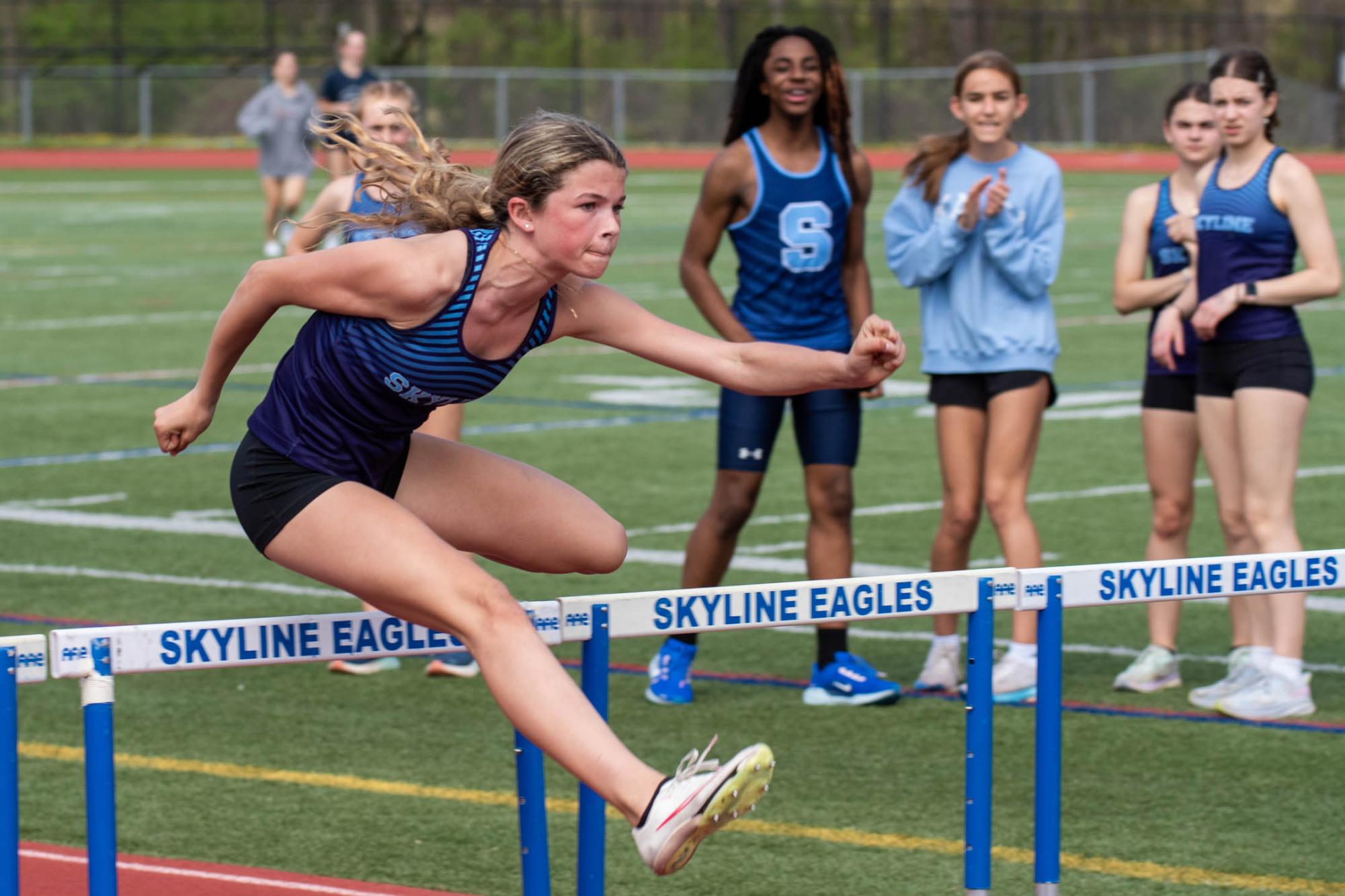 Tynne Hannahs ('27) sprinting the 100m hurdles to achieve a new school record