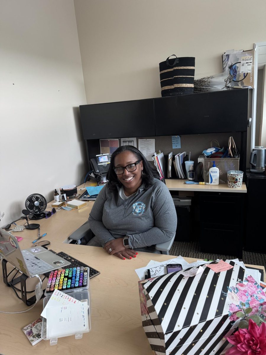 Ms. Fluker is sitting in her office.