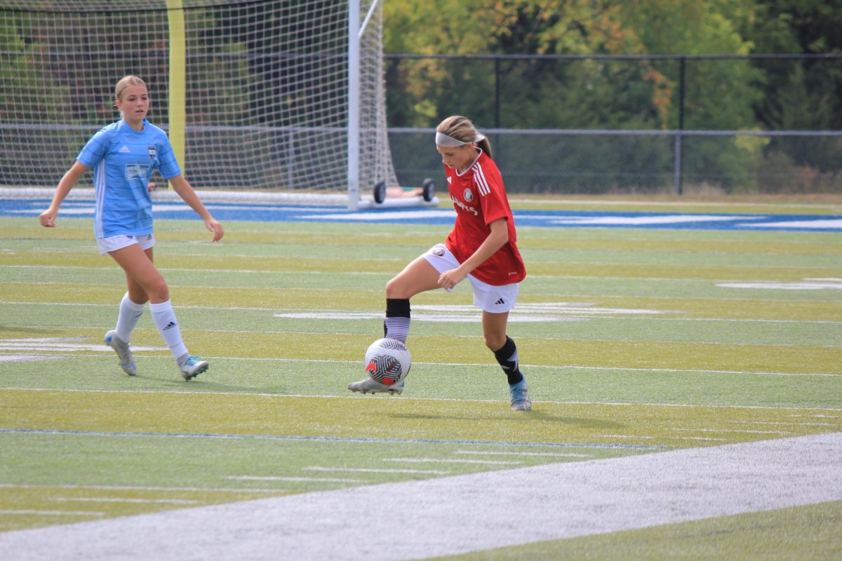 EJ Landefeld practices her soccer skills