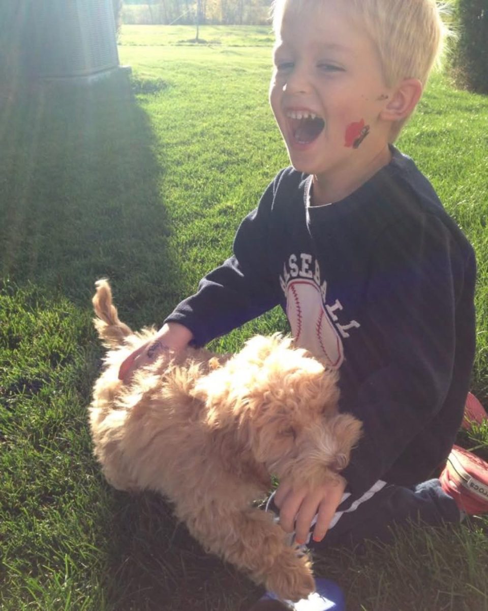This is Chad Carr as a child playing with his puppy