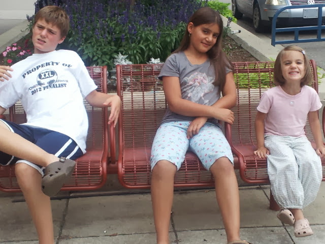 Adira ('26) sits beside her two older siblings, Keren ('20) and Elijah ('18), as she waits for ice cream.