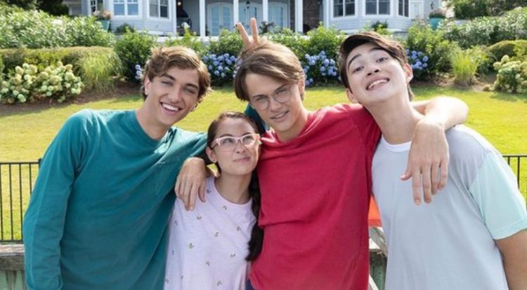 Jeremiah, Belly, Conrad, and Steven posing for a photo at the summer house.