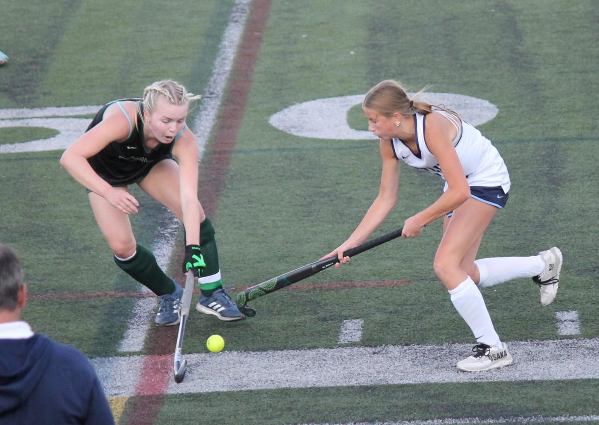 Libby Carey ('29) tries to get around the opposing defender.