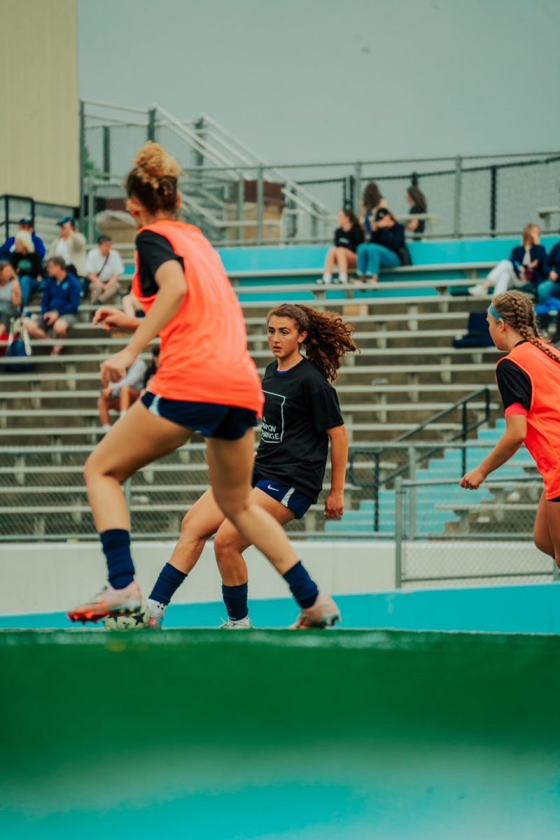 Kennedy Wassef ('26) warms up for her soccer game.