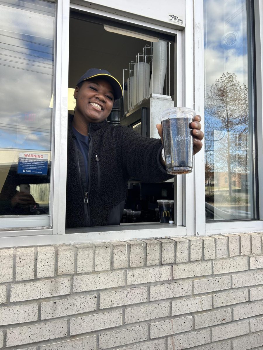 Amaya Canada ('27) holding a diet coke in Mcdonalds drive thru.