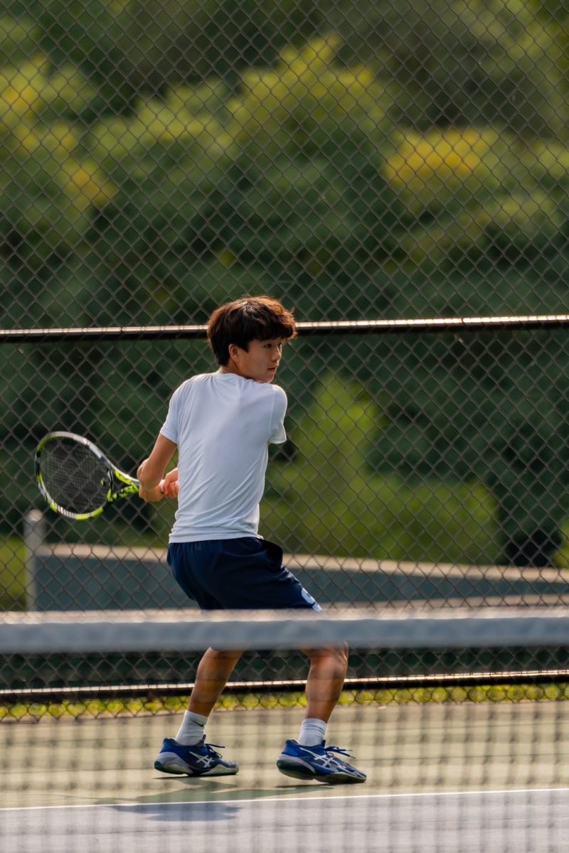 Josh Lee ('27) lines up a backhand 