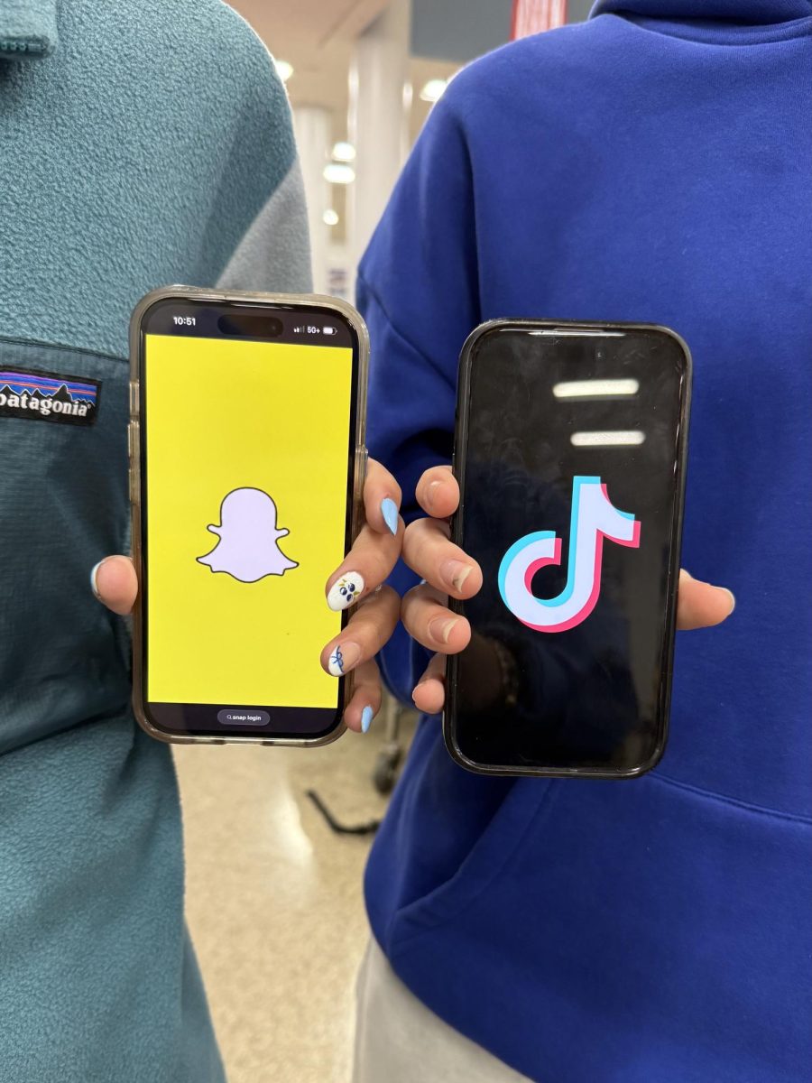 Norah Uppuluri (29') holding up the Snapchat logo.
Gwendolyn Armstrong (29') holding up the TikTok logo.