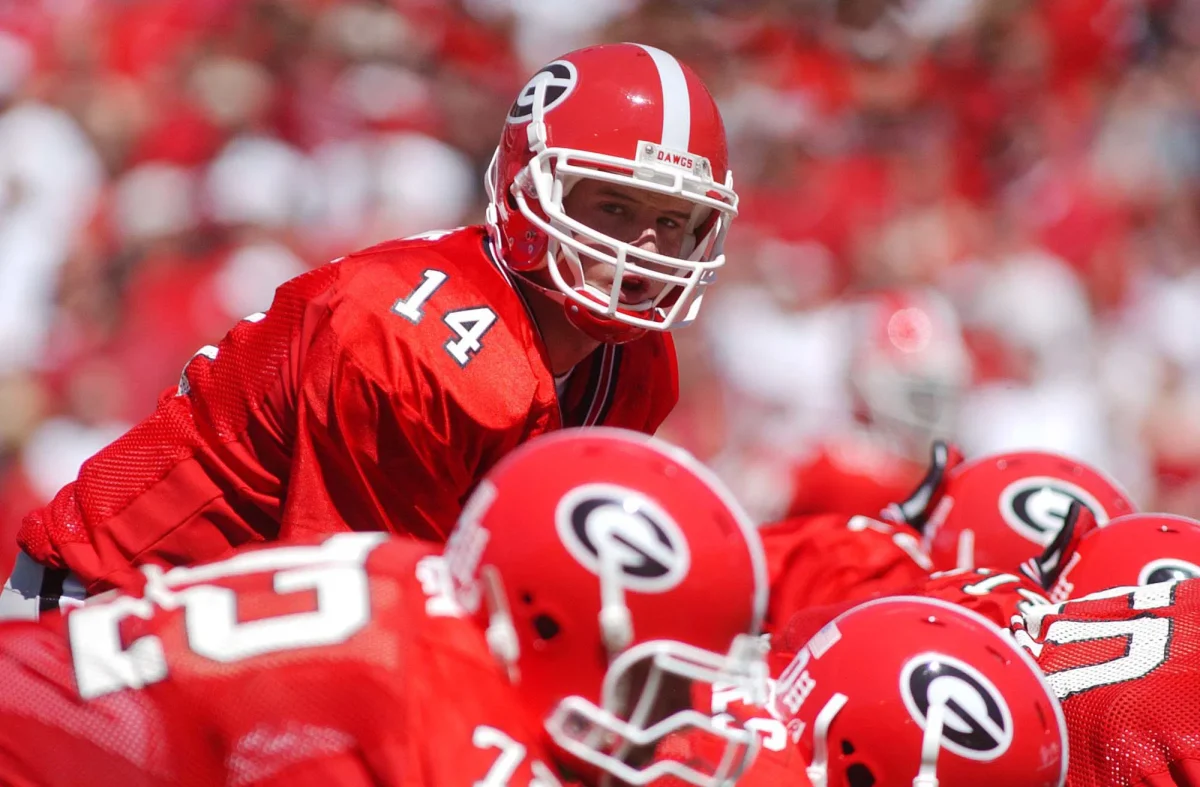 The Georgia Bulldogs get set at the line of scrimmage to run the play.