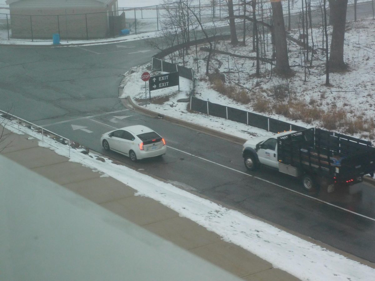 Two vehicles driving on Skylines back road in icy conditions.