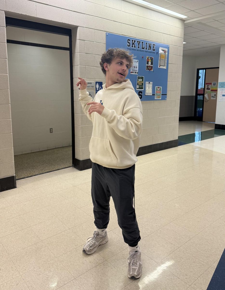 Noah Scherer '26 Pretending to throw a football.