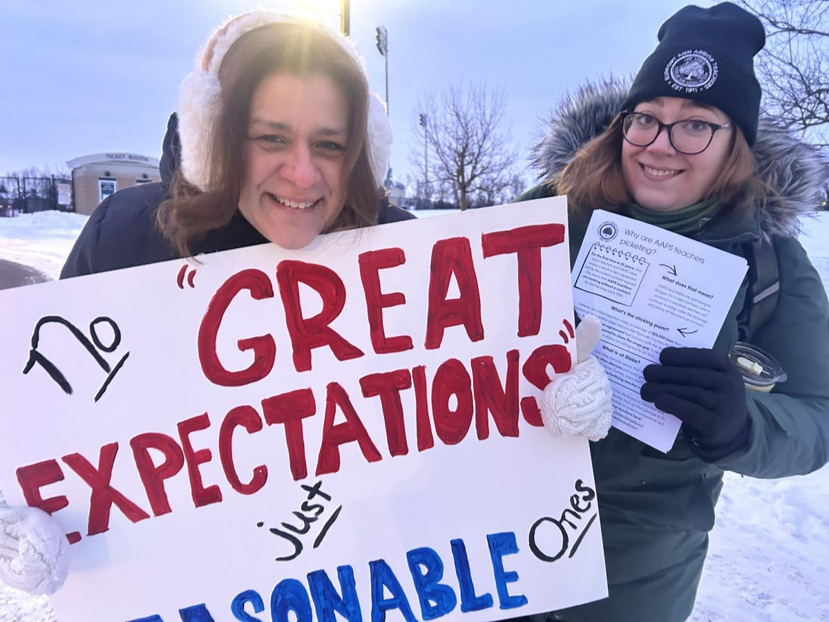 Staff members picketing out side of Skyline before school
