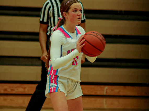 Josie Lovelace ('28) tosses the ball in during the pink out basketball game.