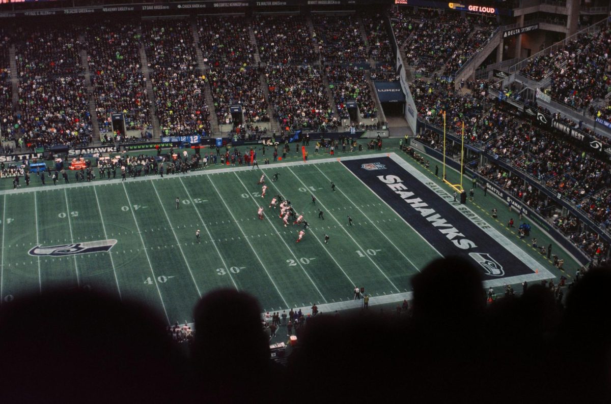 A packed crowd watches a Seattle Seahawks game at Lumen Field.