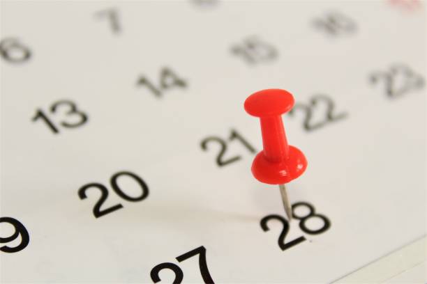 Thumbtack on calendar - end of February.