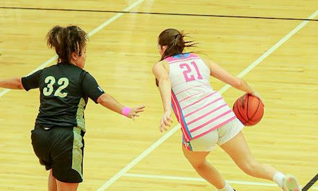 Sadie Jordan ('28) dribbles the basketball down the court.