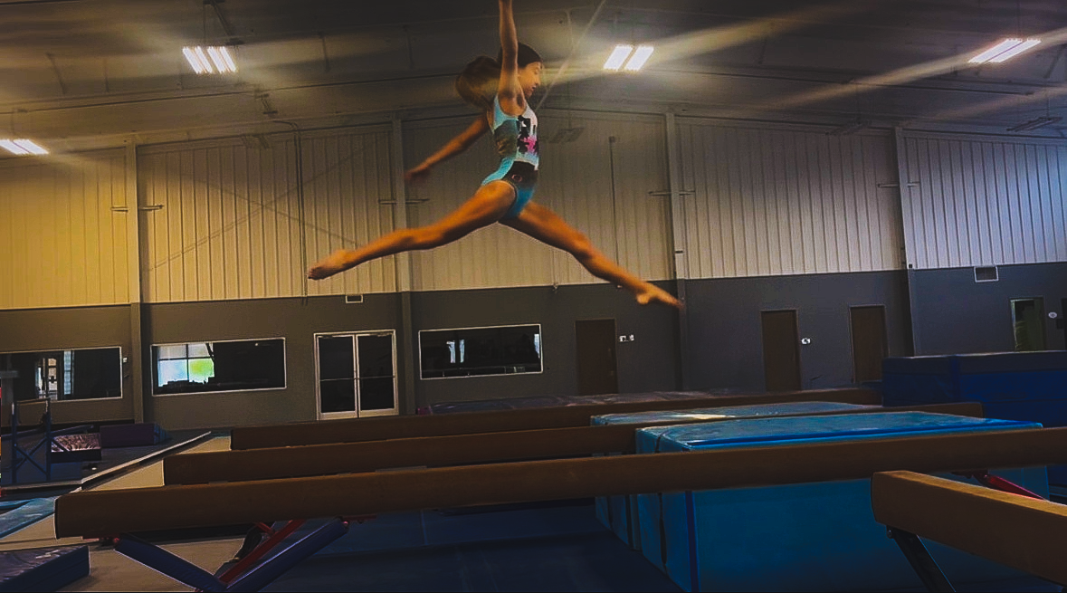 Lucy Hakala ('29) executing a beam routine during one of her practices.