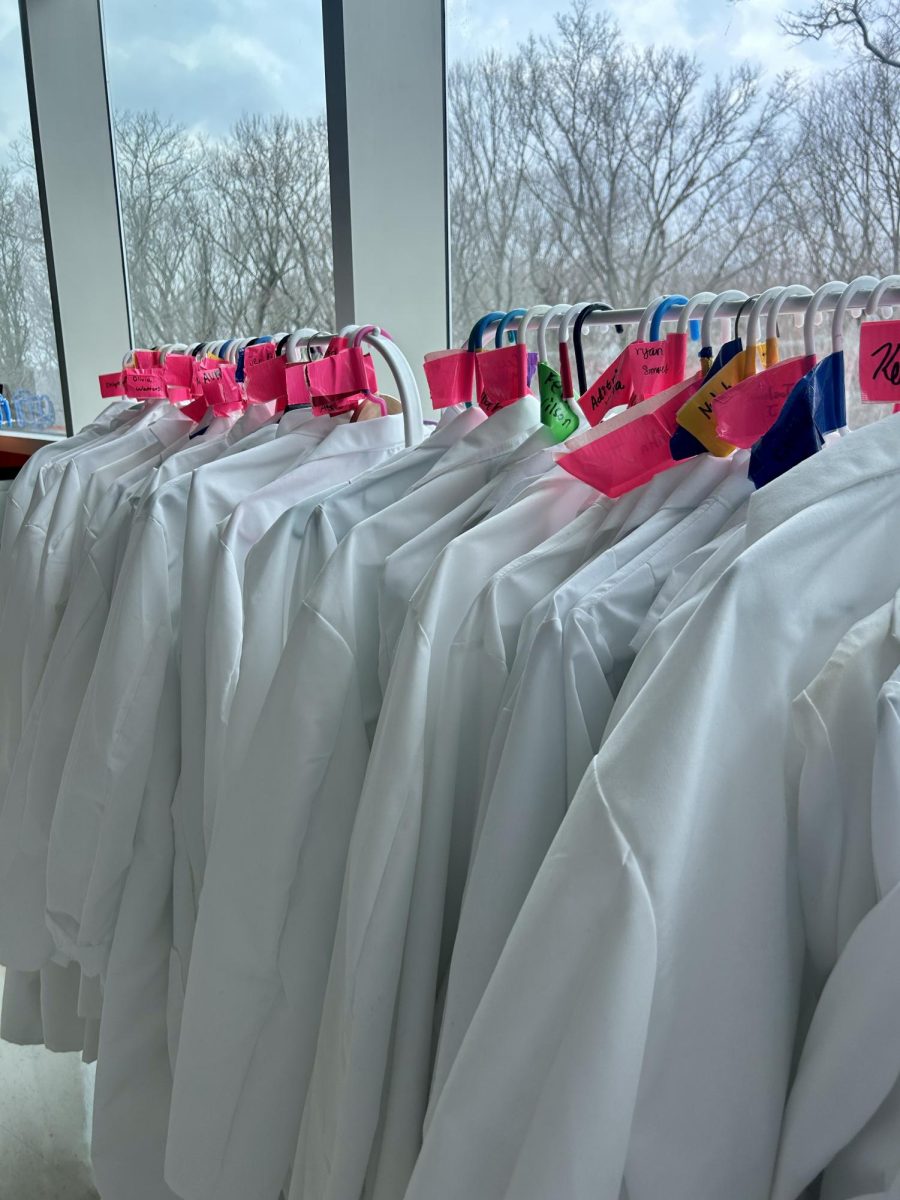 Student's lab coats hanging in the Medical Magnet room. 